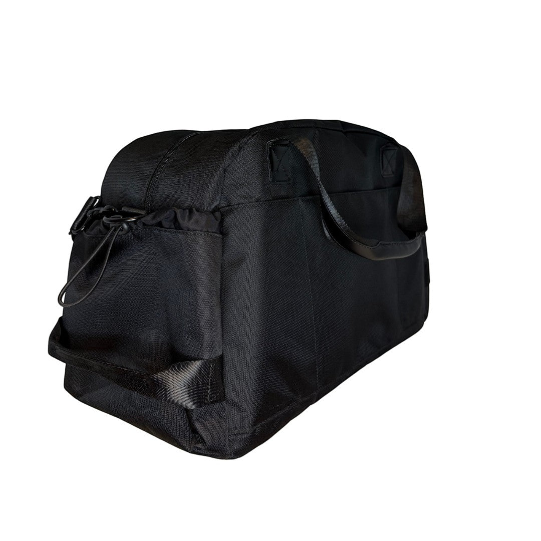 BirdieBox black nylon duffle bag with leather handles and multiple exterior pockets, ideal for travel or gym.