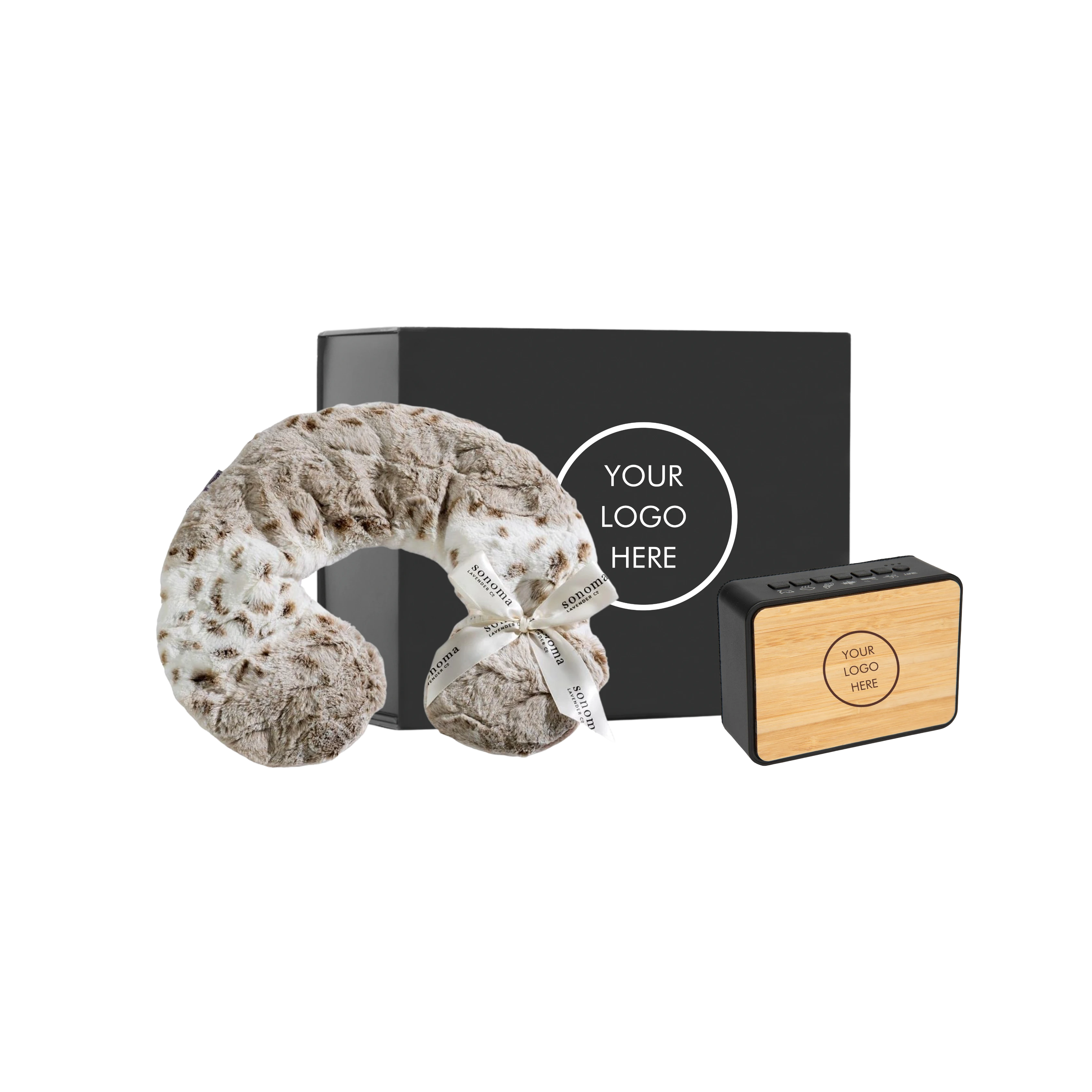 BirdieBox Stay Cozy, Stay Loud gift set featuring a plush, speckled neck pillow and a bamboo Bluetooth speaker.