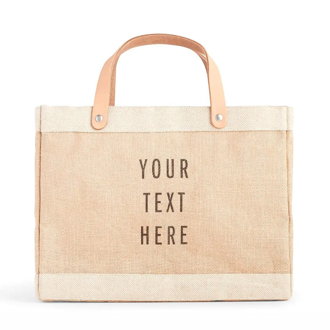 BirdieBox personalized natural jute tote bag with faux leather handles and custom text.
