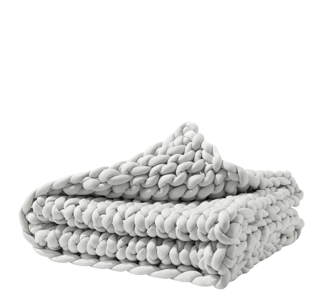 BirdieBox white chunky knit weighted blanket made of soft bamboo jersey, 42x65 inches.