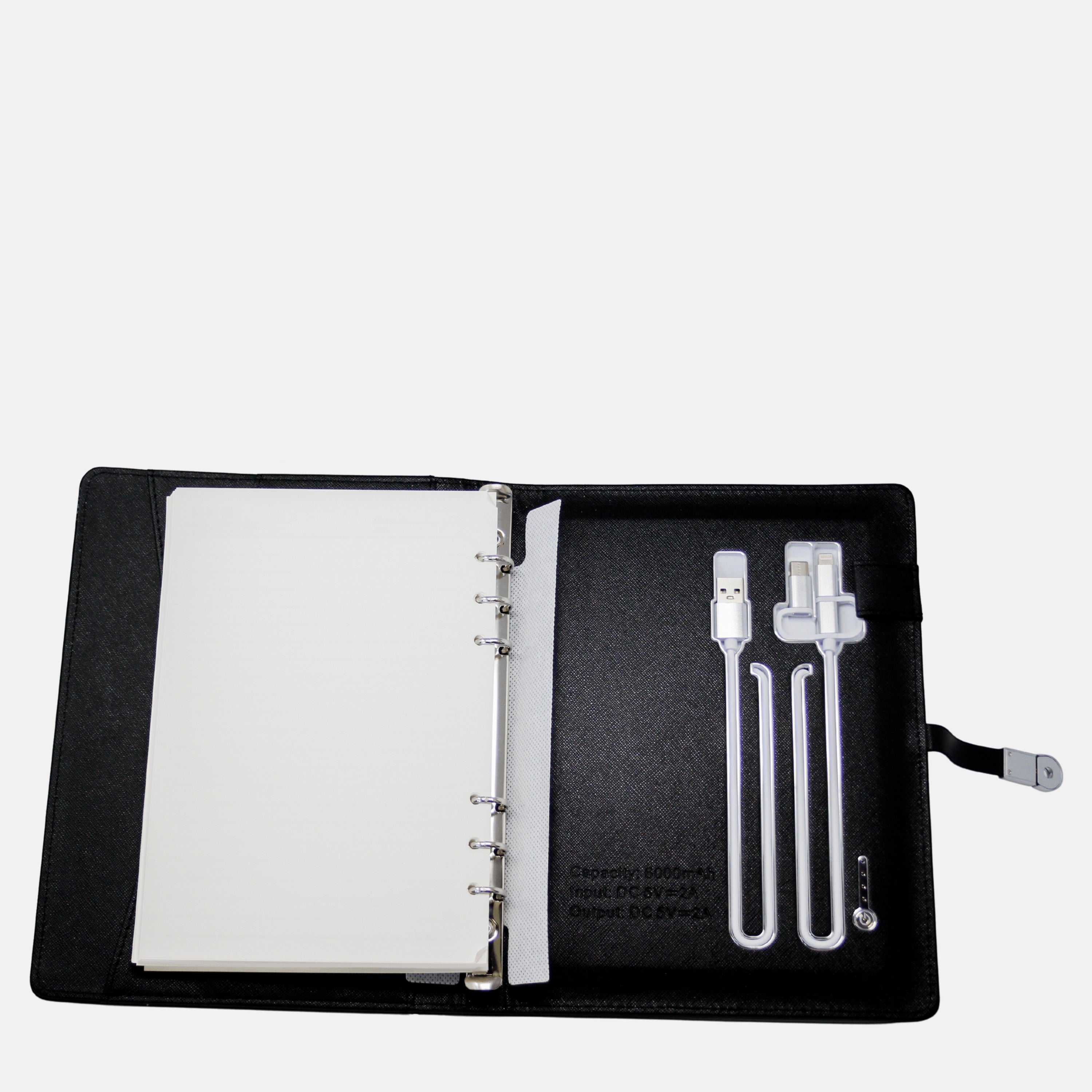 BirdieBox black synthetic leather journal with Qi wireless charging, 6000mAh powerbank, hidden USB, and charging cables.