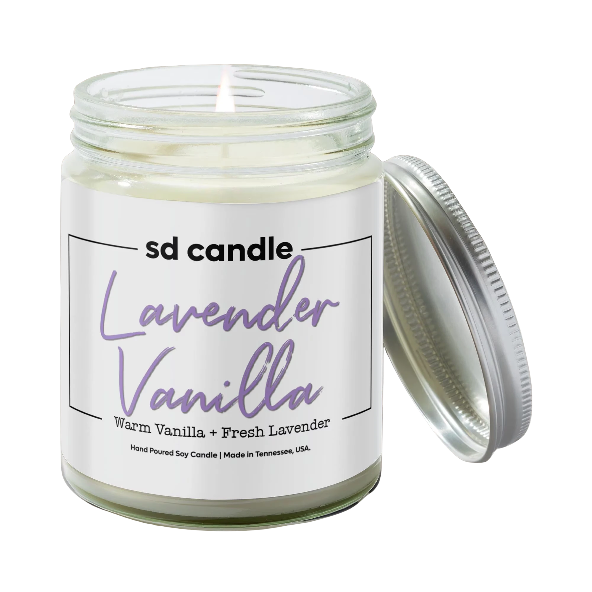 BirdieBox Lavender Vanilla Pure Soy Candle with a lit wick and silver lid ajar. Clean burning soy wax.