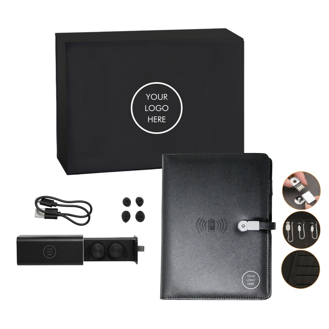 BirdieBox Office Necessities Gift Set: Black leather-look journal with wireless charging, earbuds, charging cable, and USB drive, presented in a black gift box.