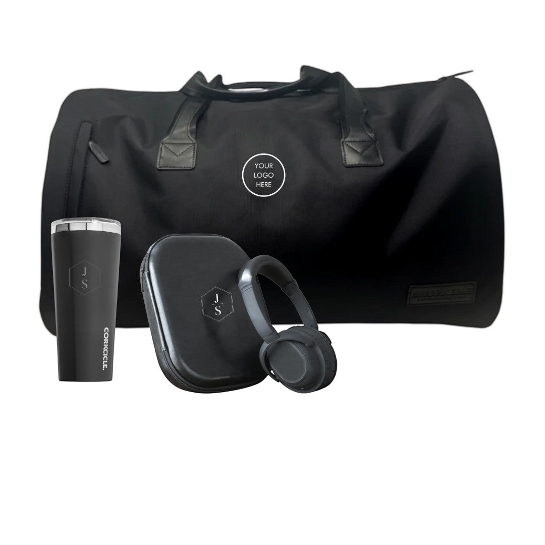 BirdieBox Weekend Trip Gift Set: black duffle bag, black tumbler, and black noise-canceling headphones with case.