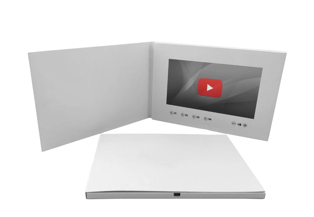 BirdieBox white video booklet with screen displaying YouTube logo and playback controls, closed booklet in foreground.